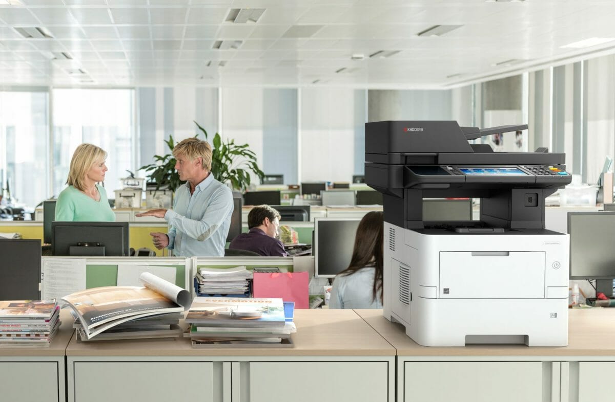 Kyocera ECOSYS M3645idn desktop A4 multifunction printer in use in an open plan office