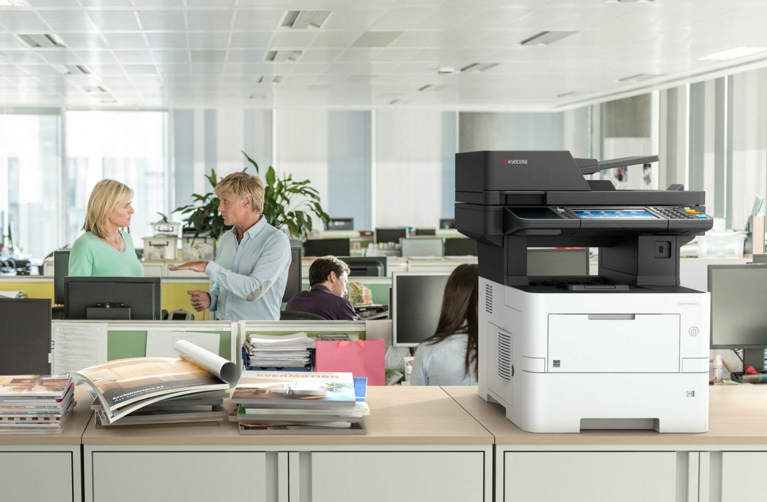 Kyocera ECOSYS M3645idn desktop A4 multifunction printer in use in an open plan office