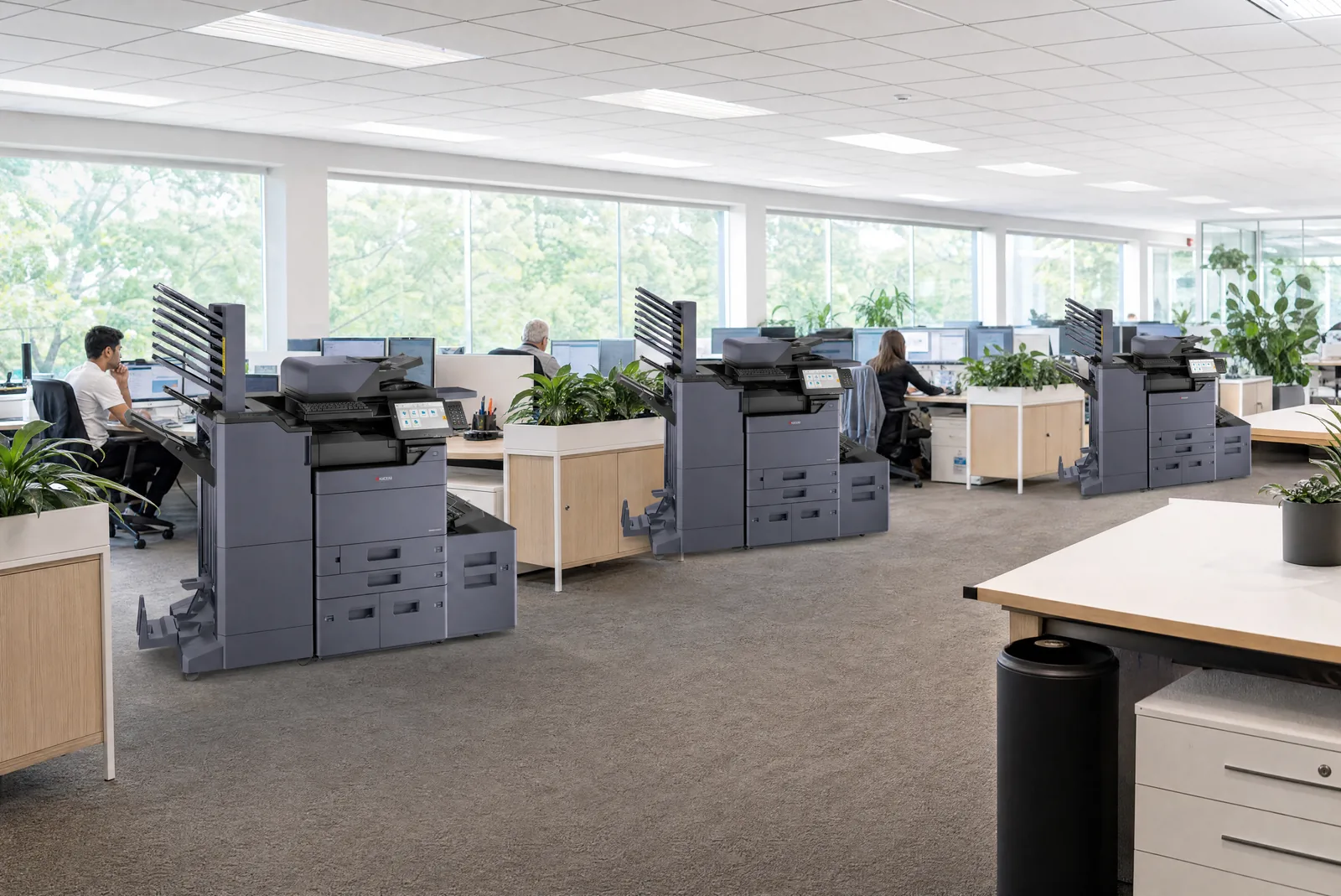 Several Kyocera multifunction printers across an open plan Australian office floor