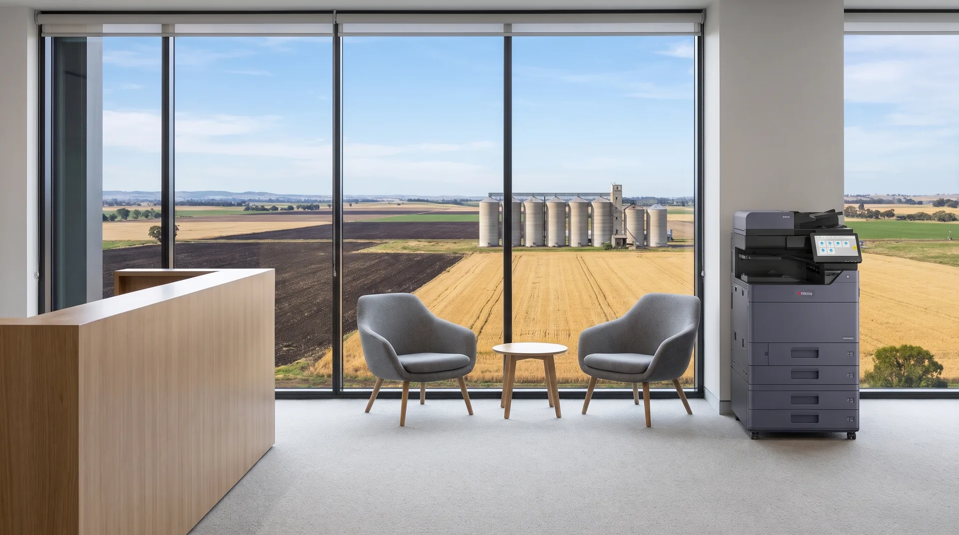Kyocera photocopier on lease in a Toowoomba reception area overlooking Darling Downs farmland and grain silos