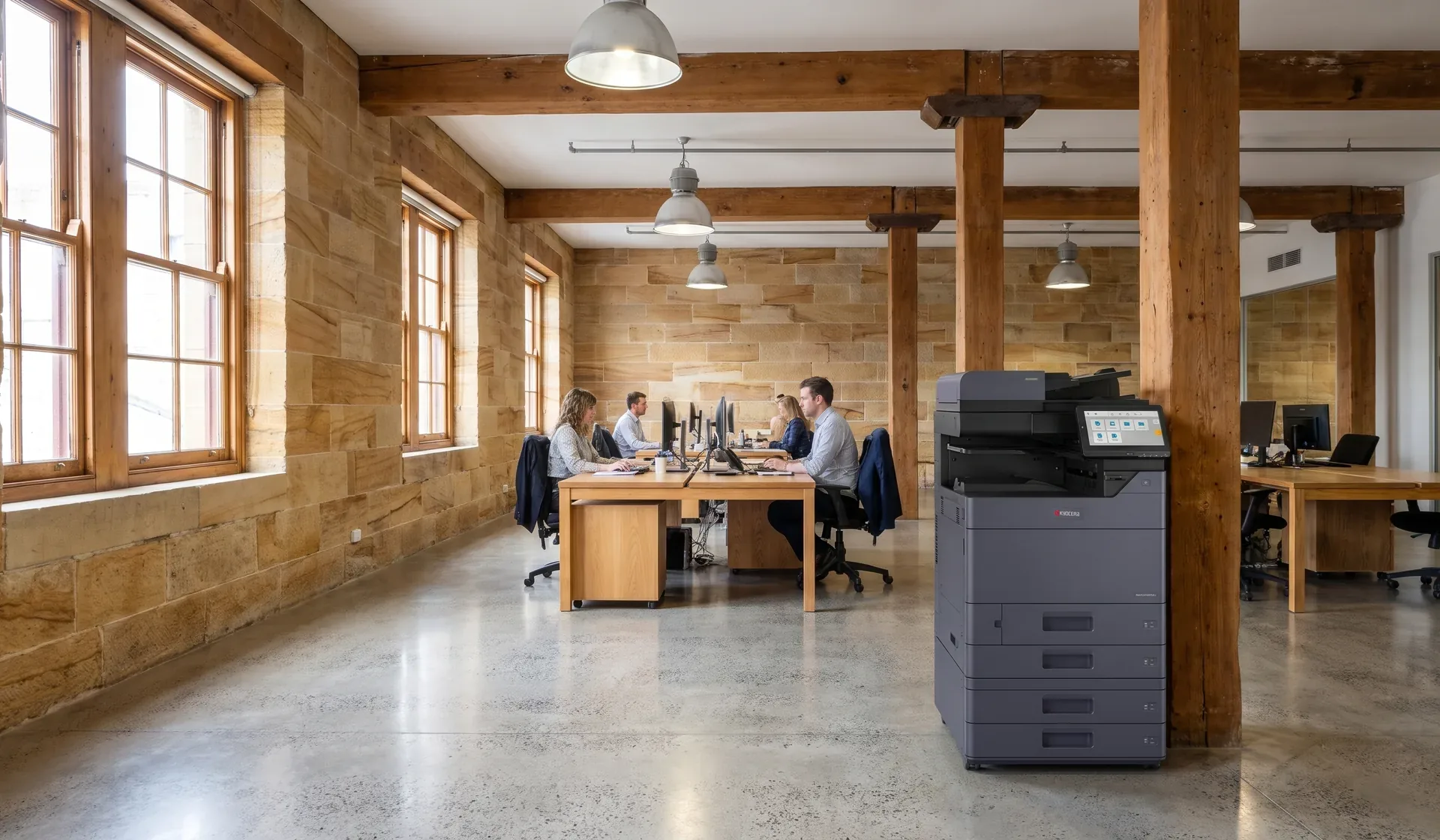Kyocera multifunction printer in an open plan Hobart office inside a converted sandstone warehouse